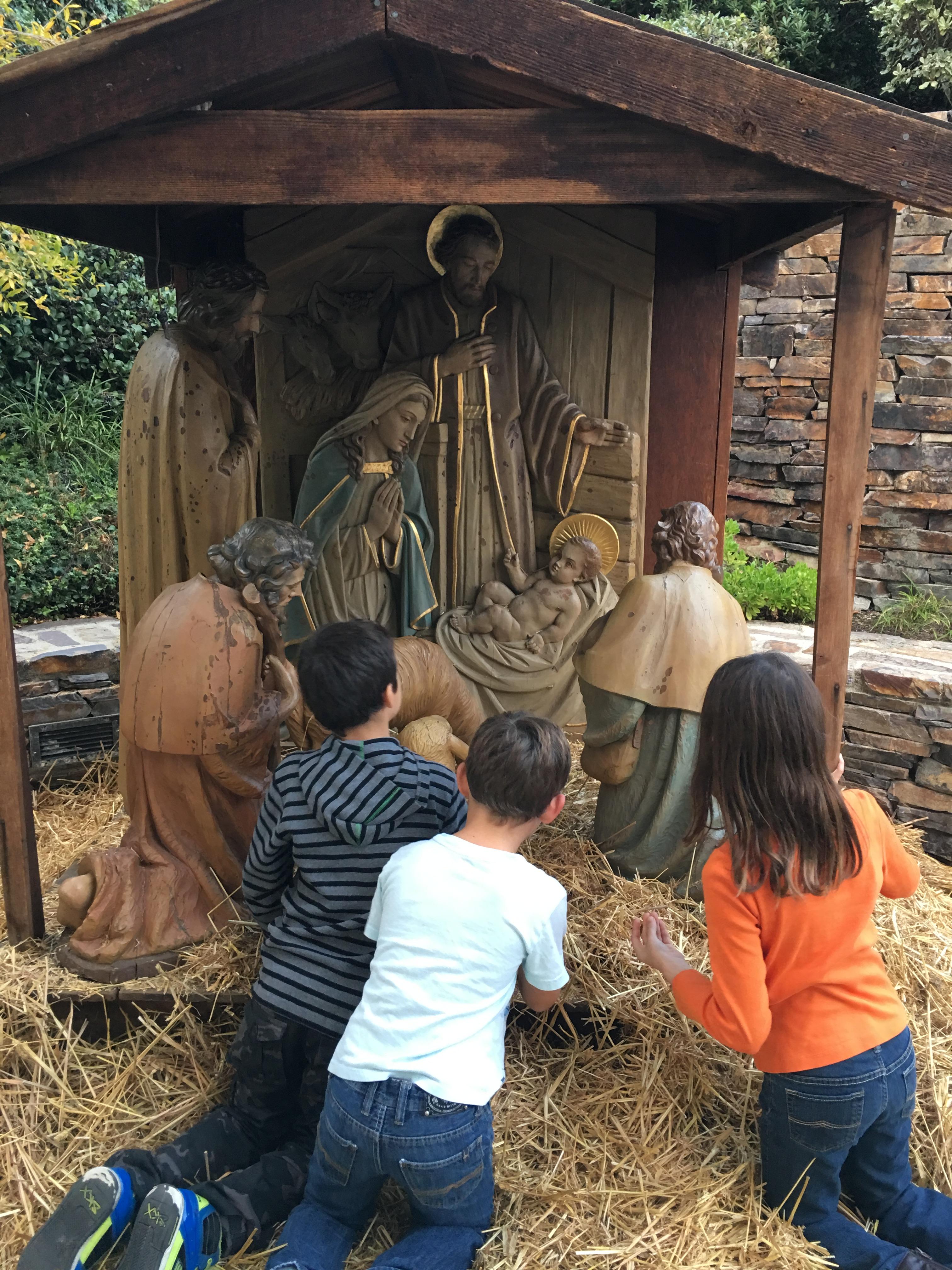 20210118 MHayes 4 My Children praying in front of Nativity