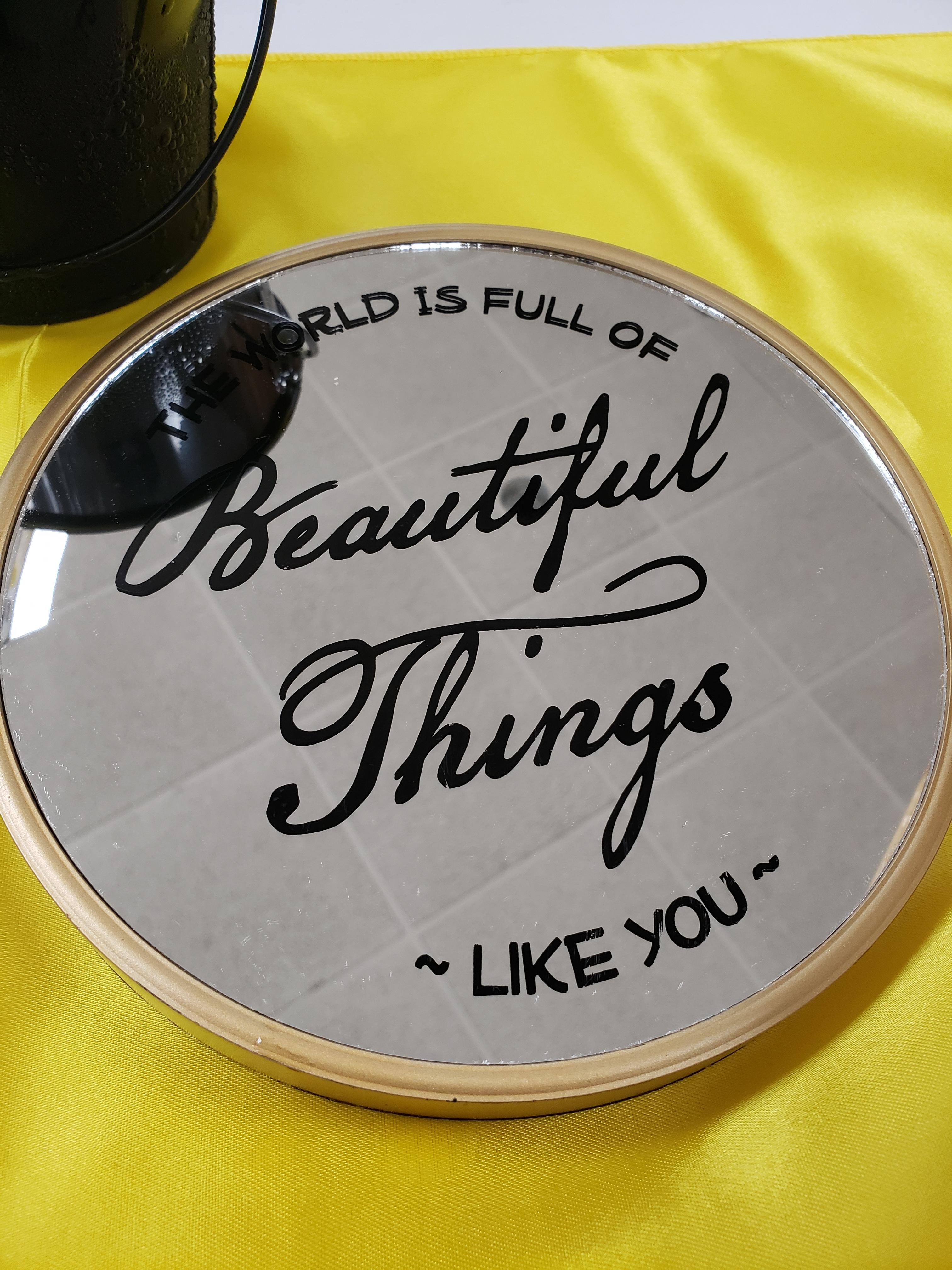 fancy dinner plate with the words "the world is full of beautiful things like you" by Melissa Presser