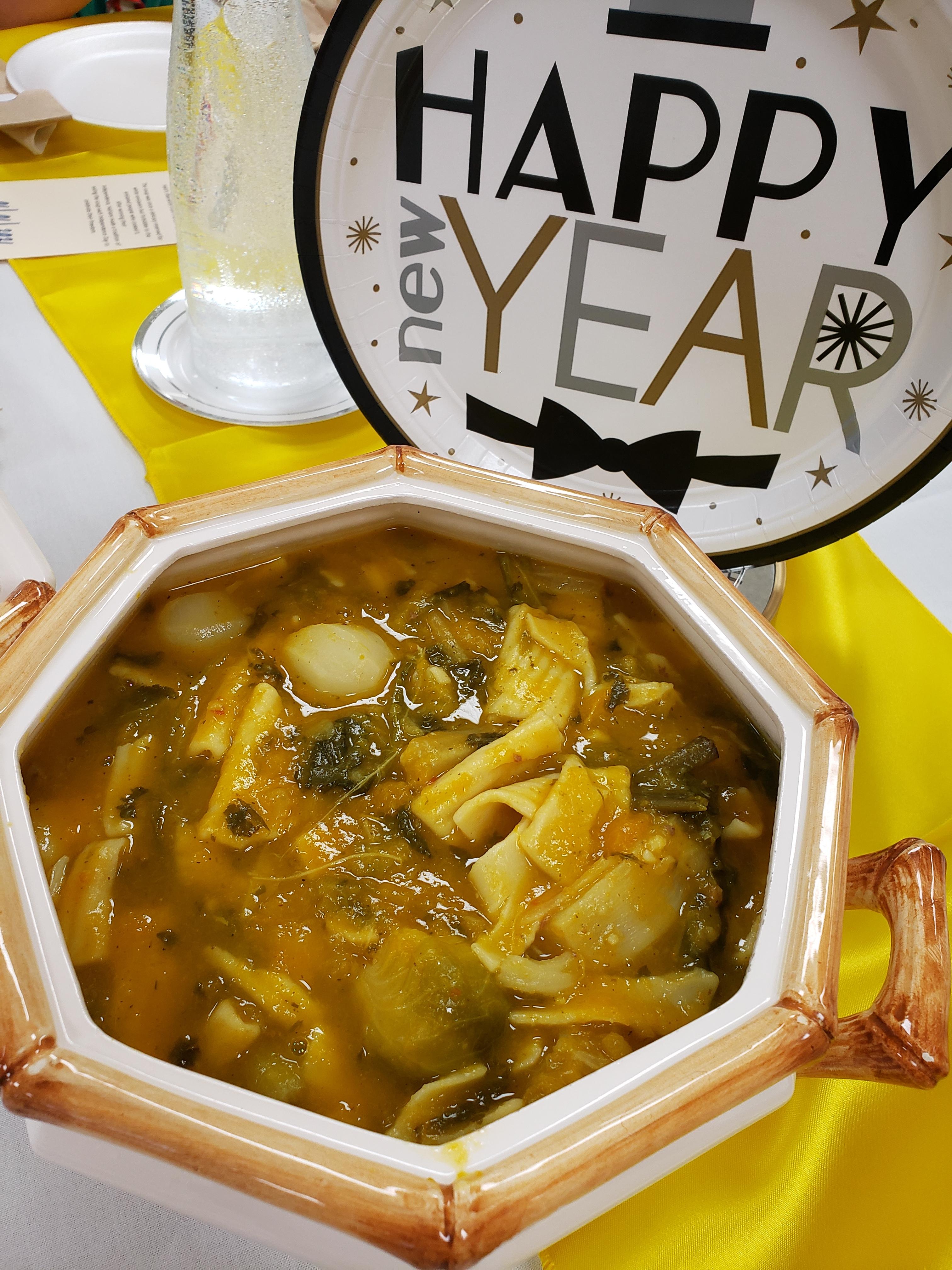 Serving bowl of soup with "Happy New Year" decorations by Melissa presser