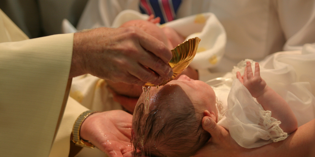 Baby being baptized in church