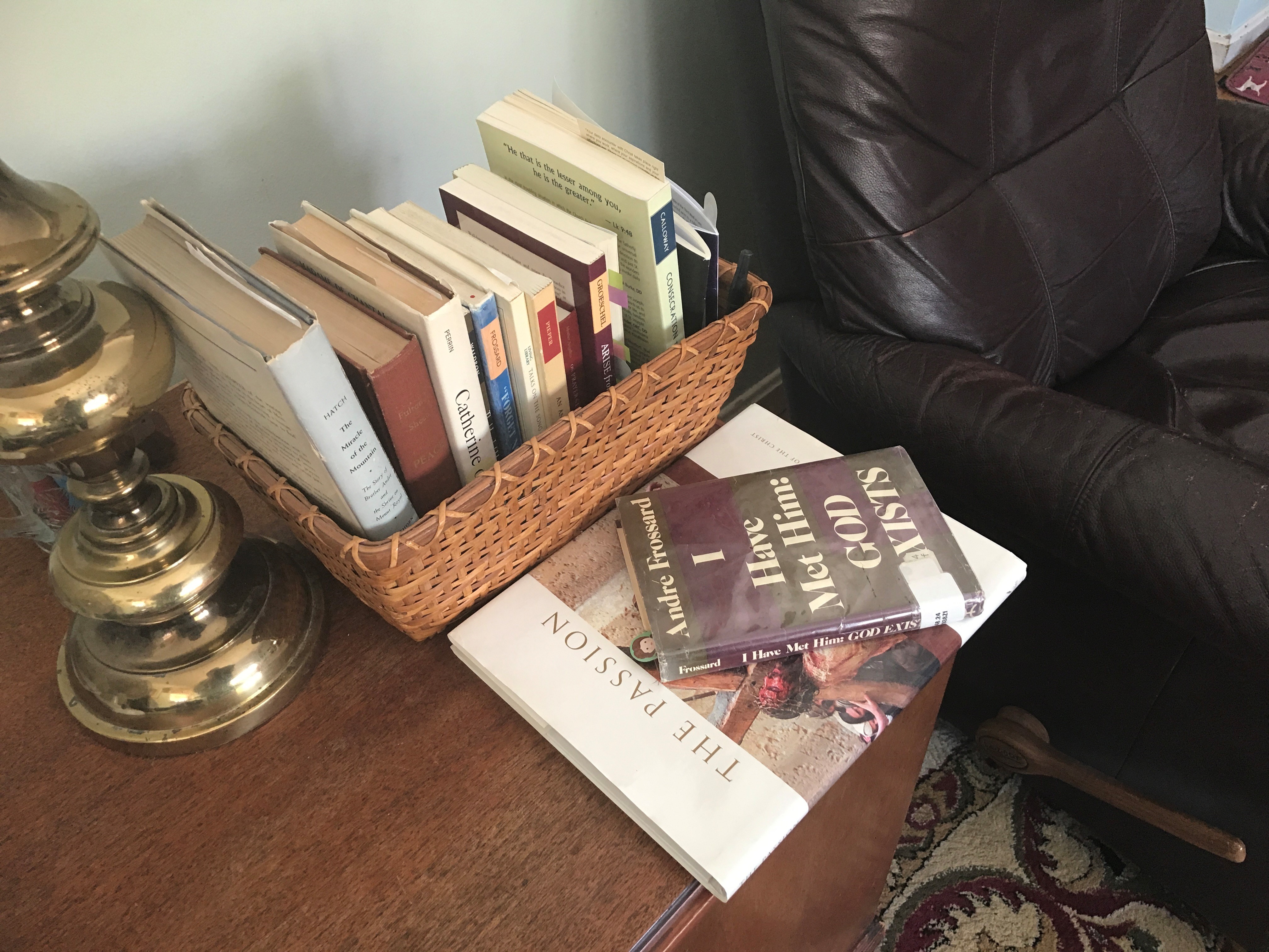 Basket of spiritual books on lamp table