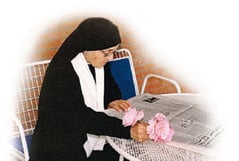 Mother Scholastica reading her newspaper