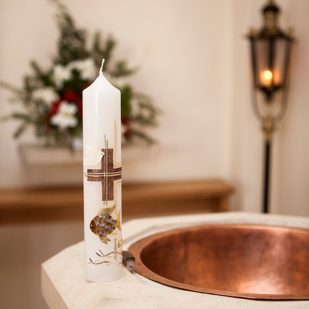 baptismal candle and baptismal font