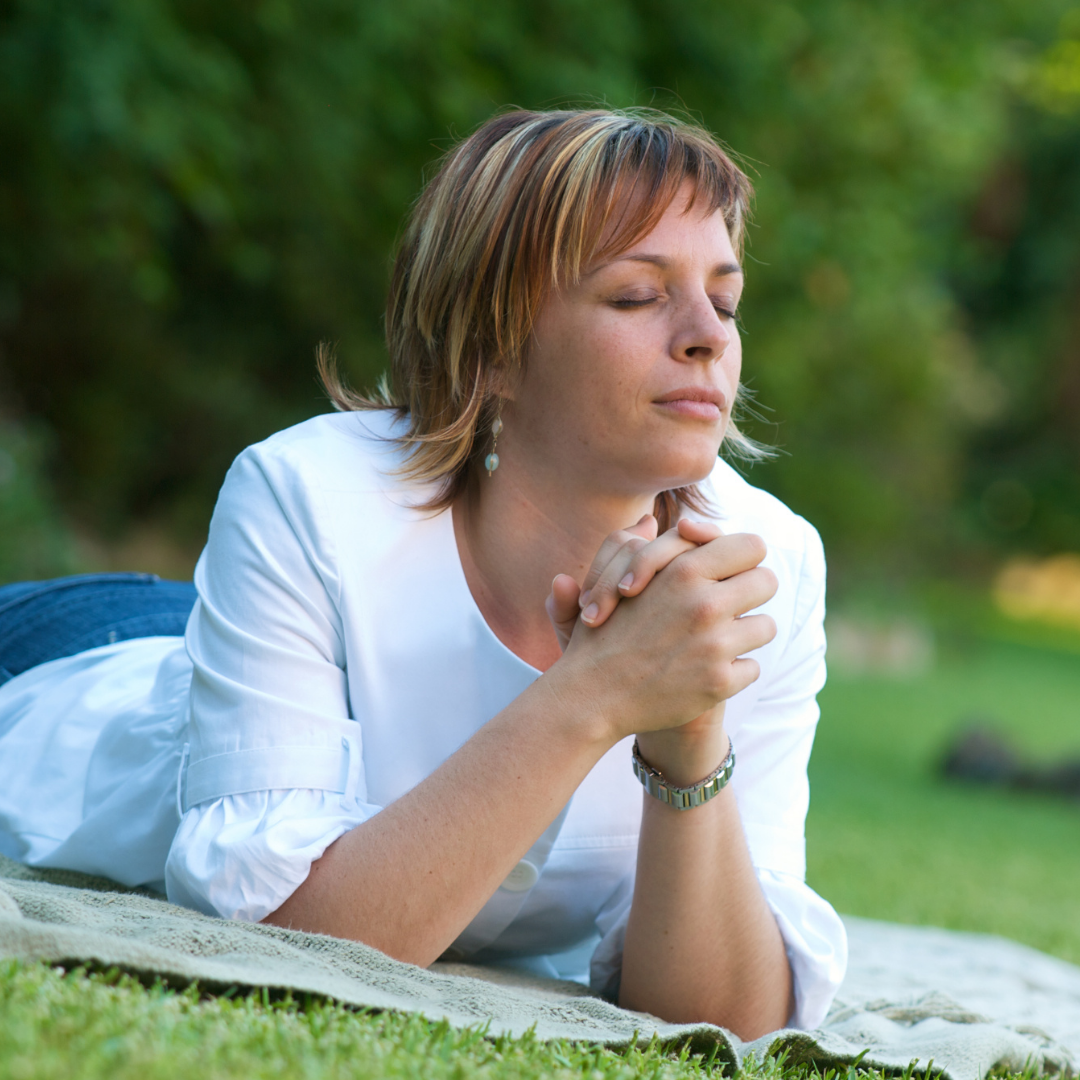 woman praying outdoors
