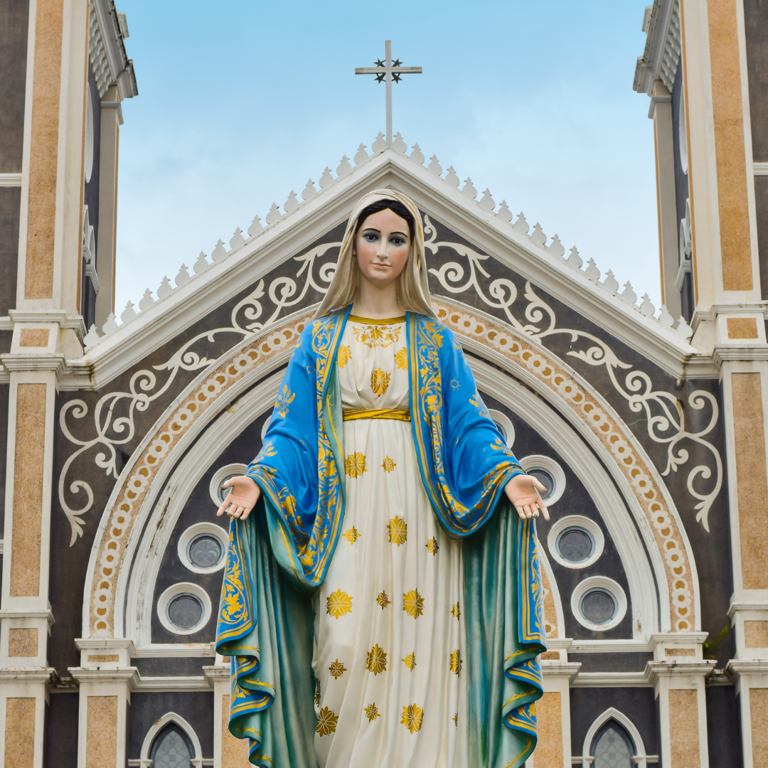 statue of Mary in front of a church