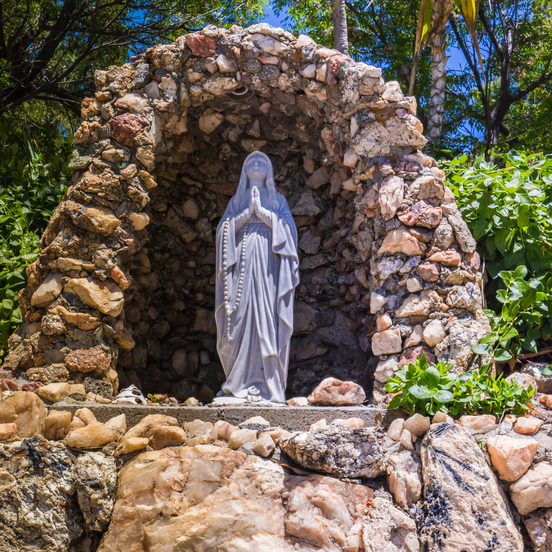 Statue of Our Lady of Lourdes in small grotto