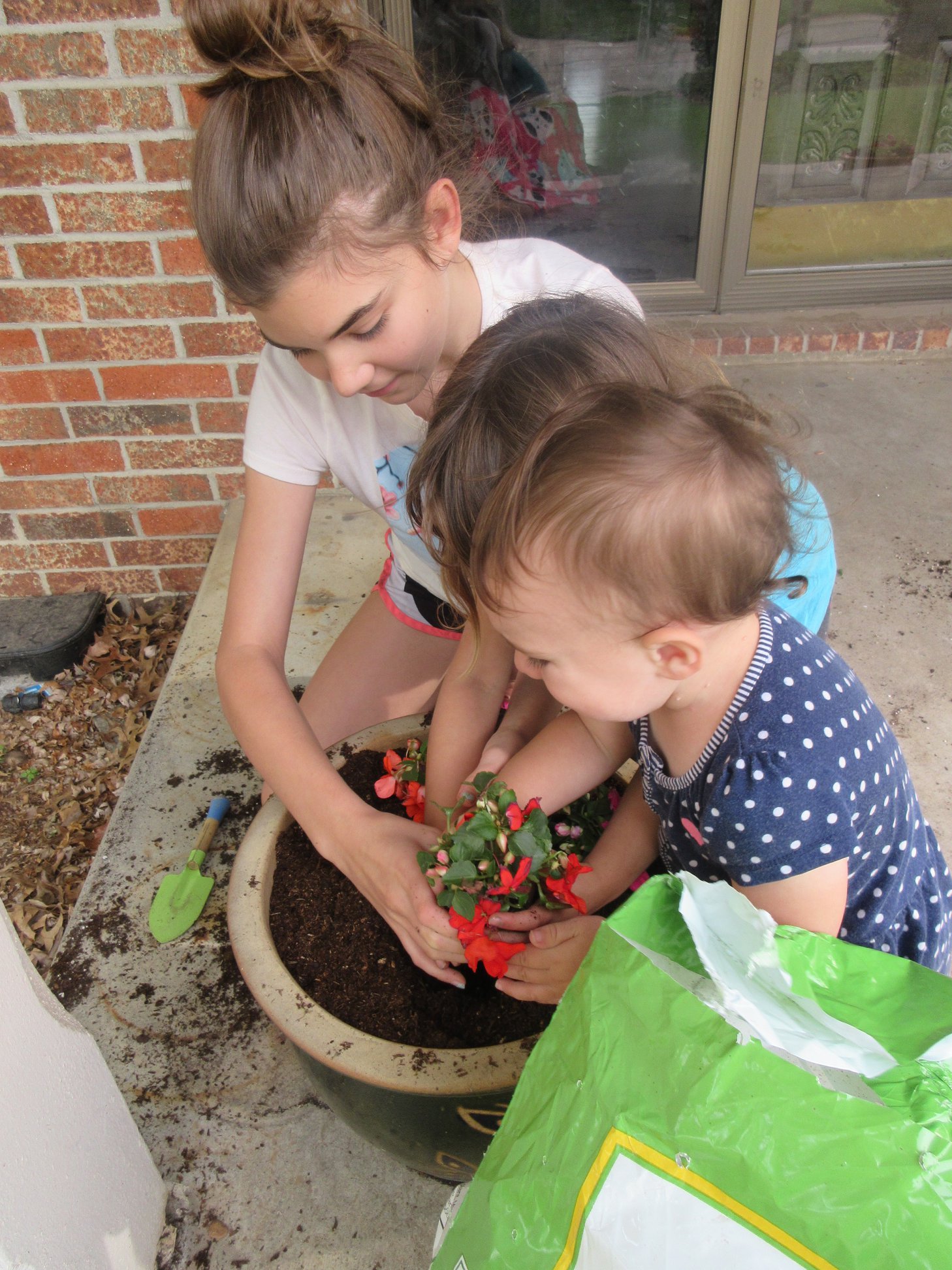 20210518 CTierney girls planting flowers