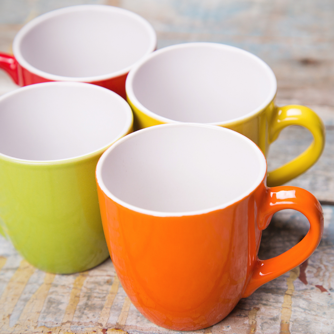 4 bright colored cups, empty