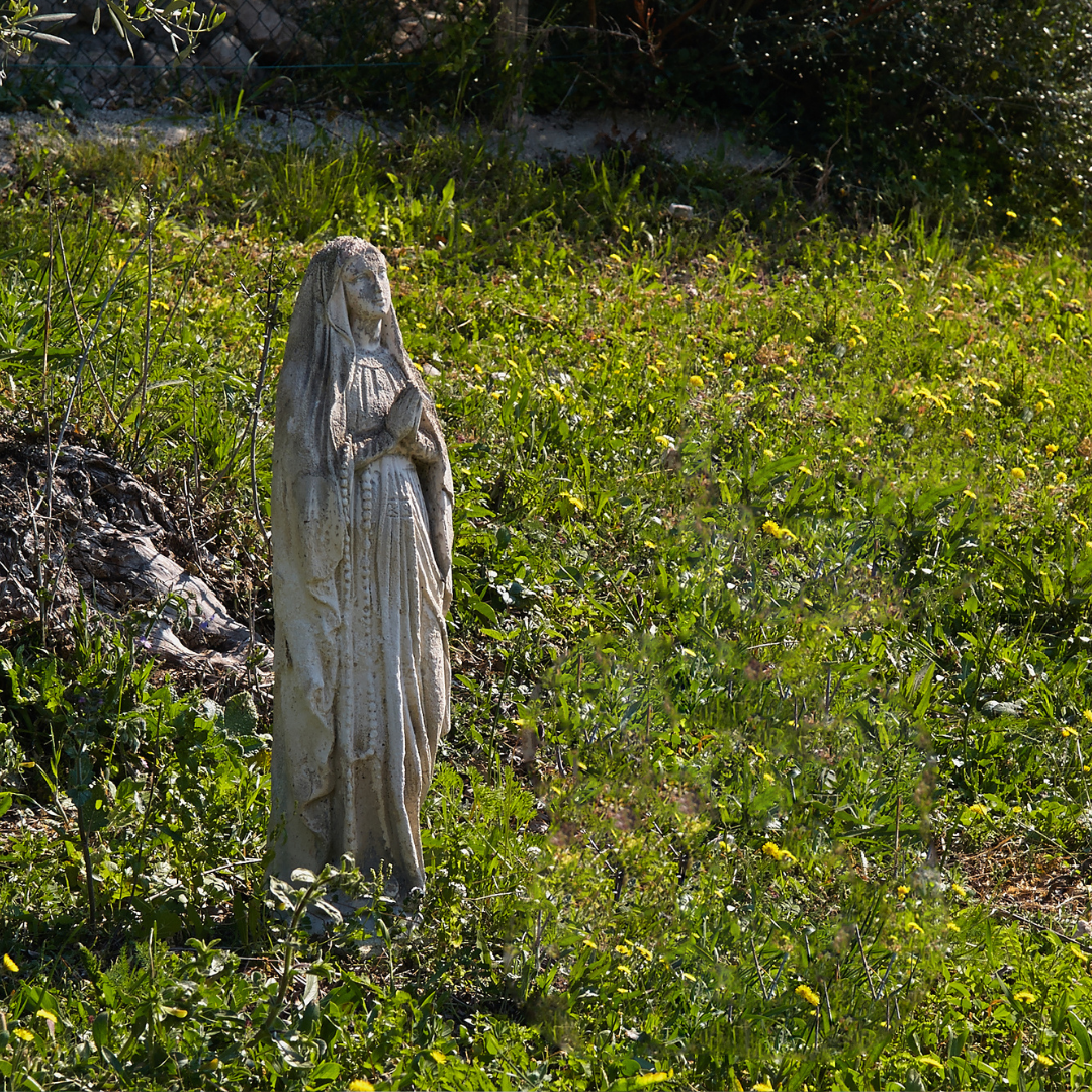 weathered statue of Mary