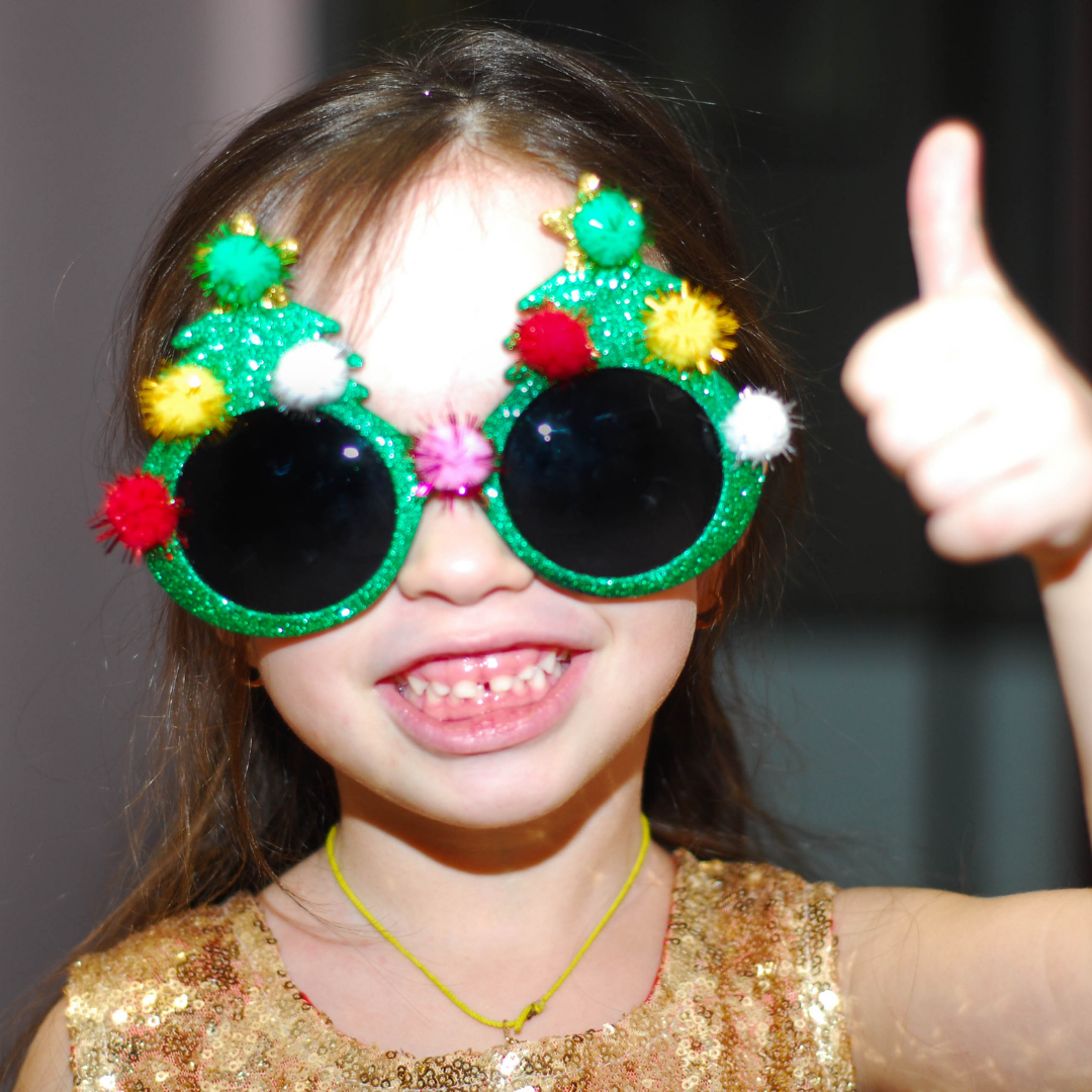 little girl wearing crazy sunglasses