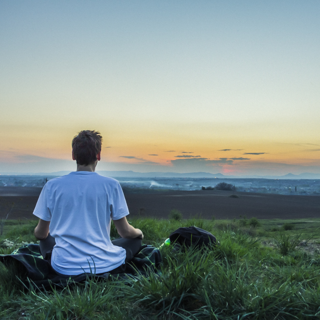 young man watching the sunrise