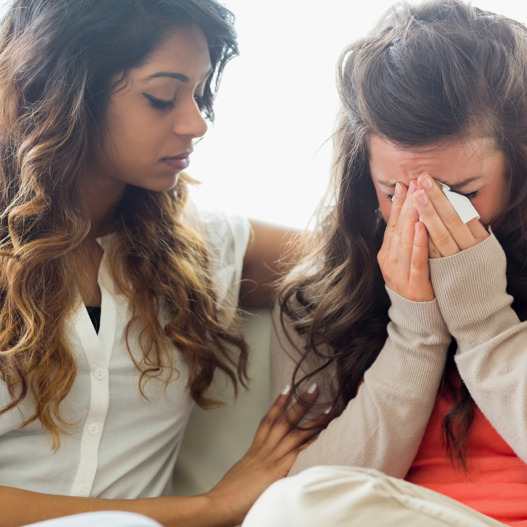 2 friends crying together