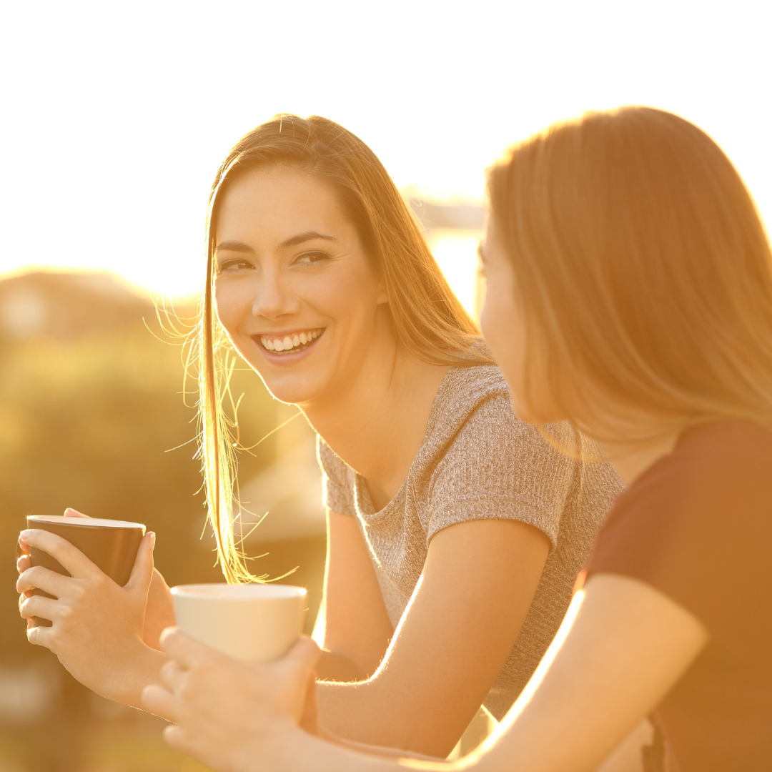 2 women talking and smiling