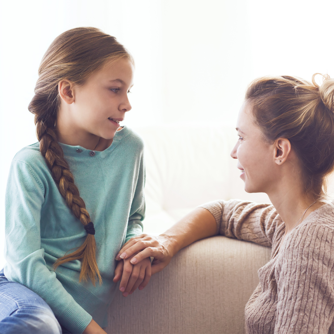 young teen talking to her mom