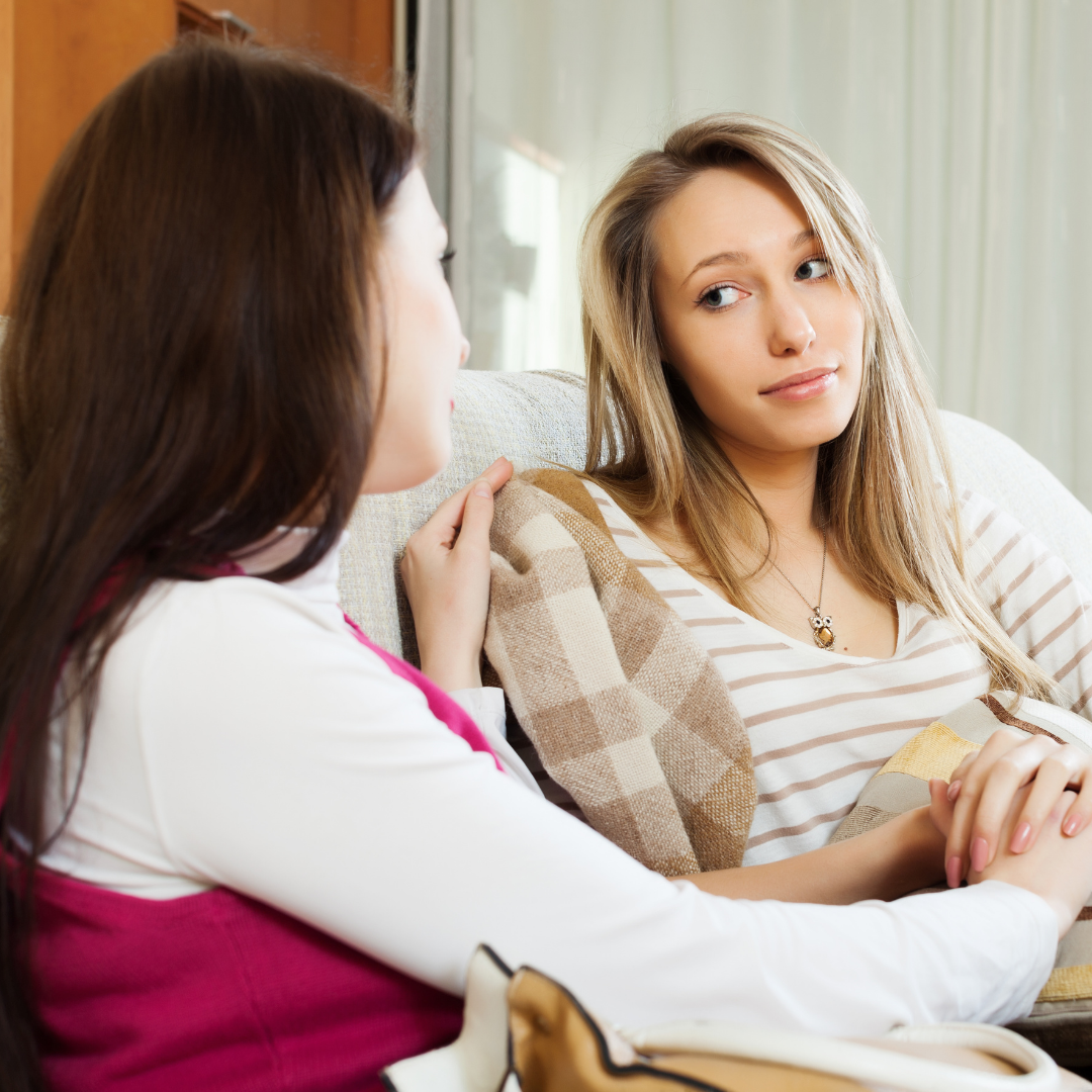 woman consoling a younger woman