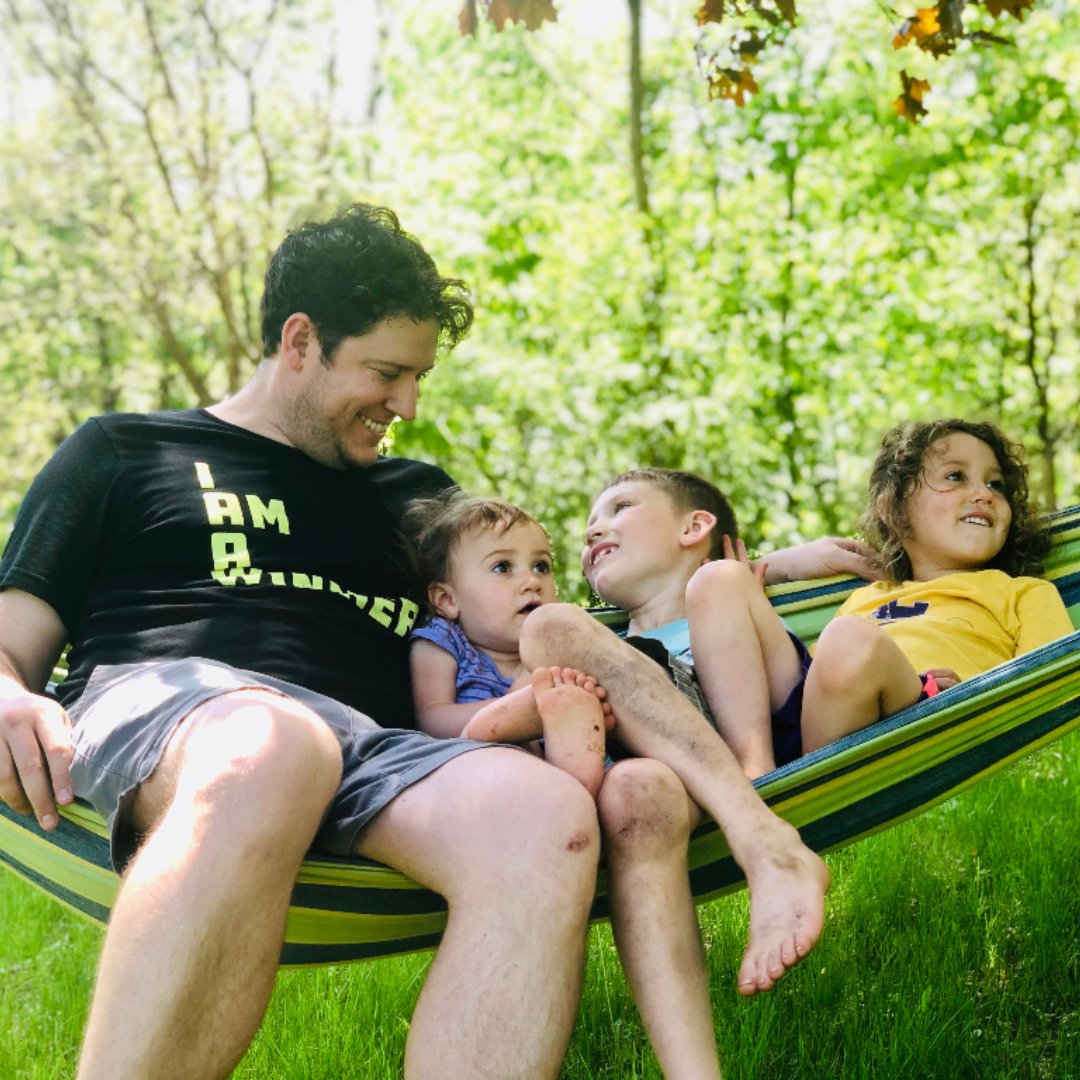dad with 3 kids in hammock