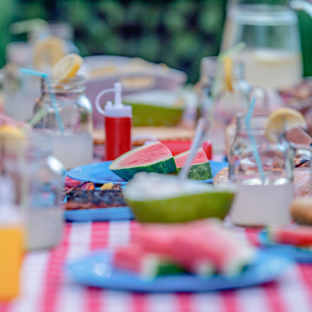 picnic table with lemonade and watermelon