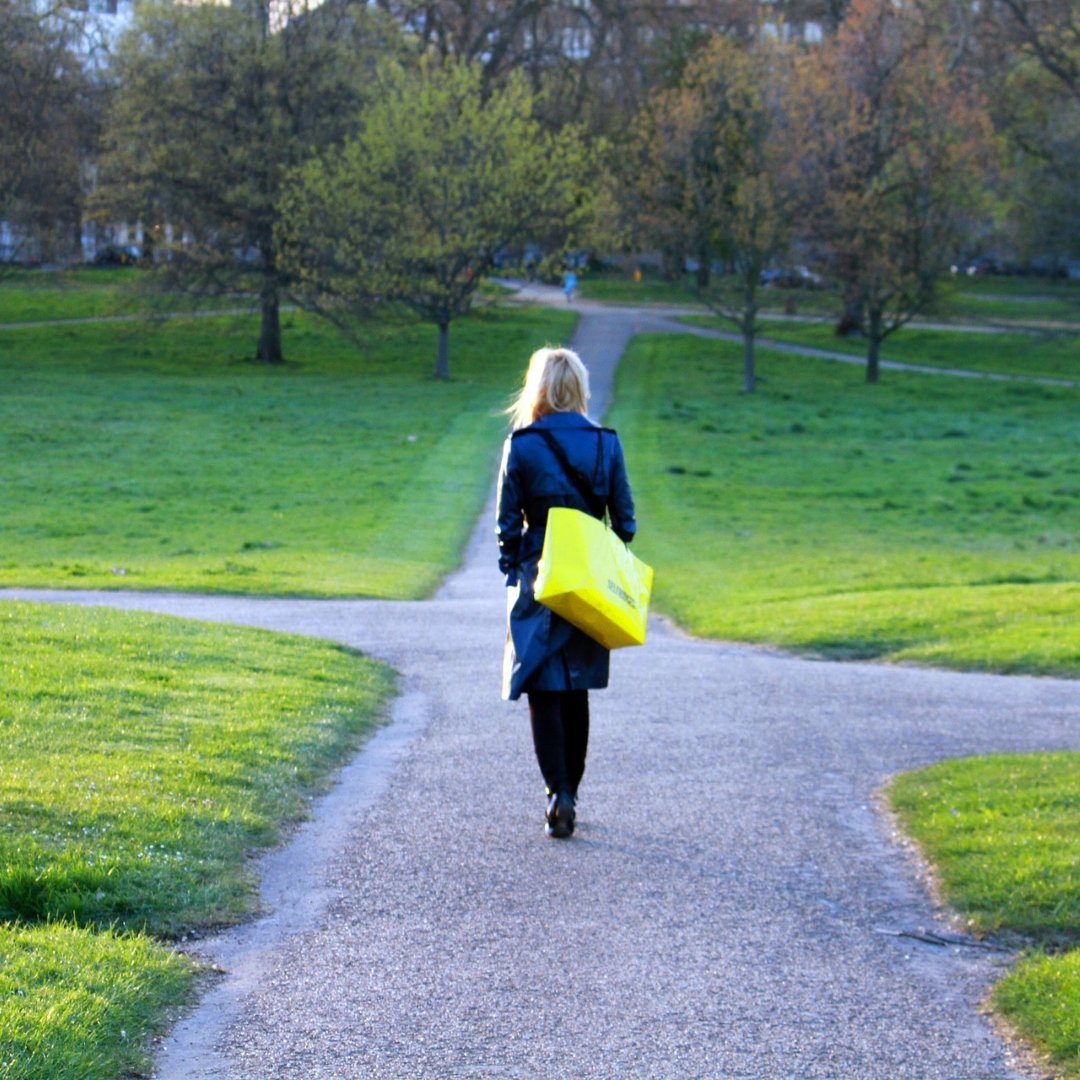 woman reaching a crossroads on a path