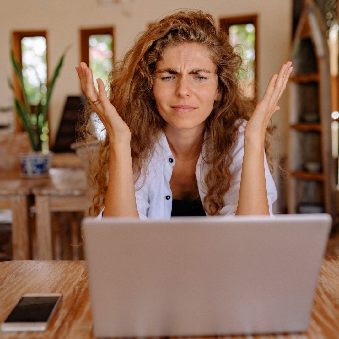 woman throwing up her hands in frustration