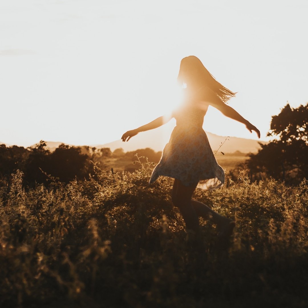 woman dancing in a field