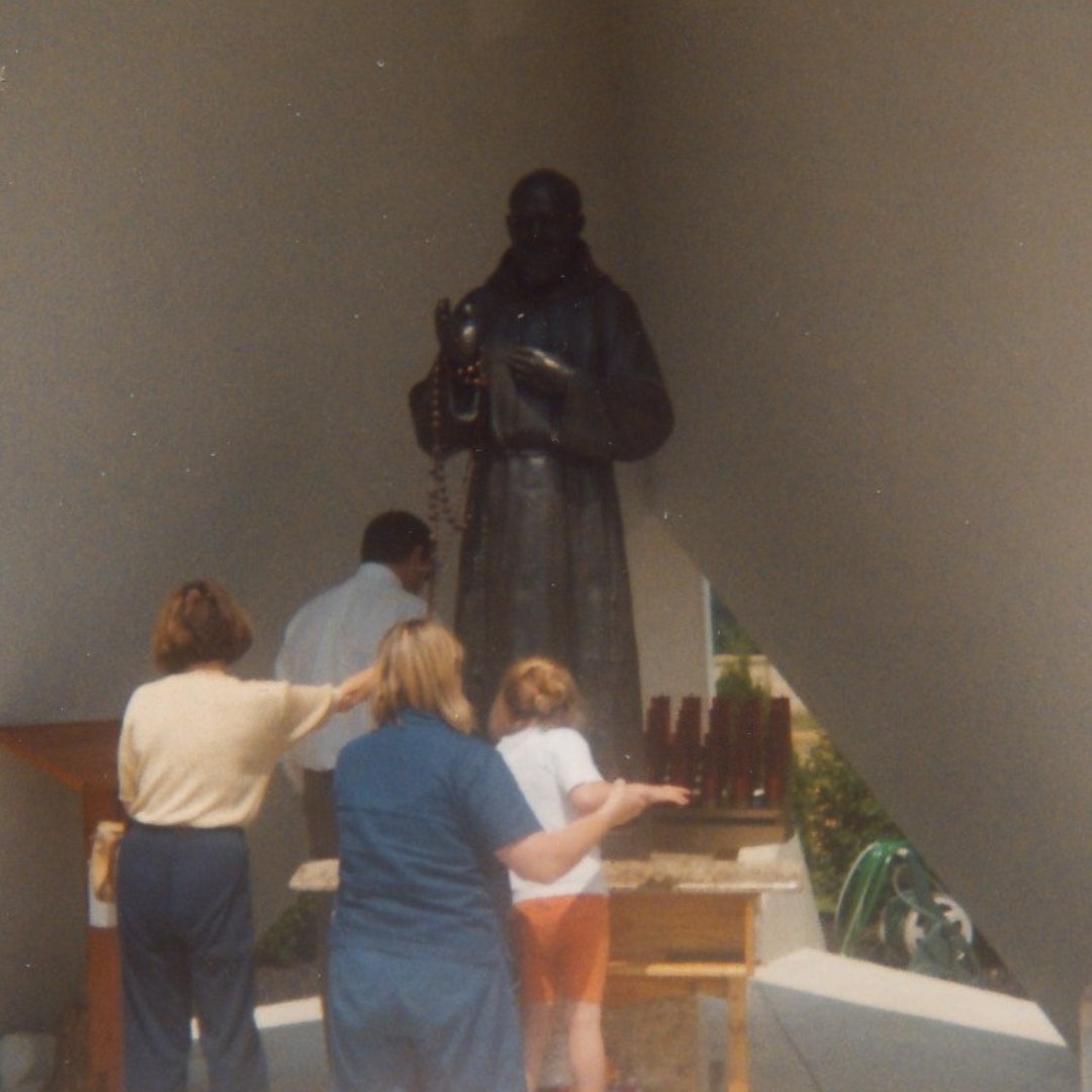 family praying at Padre Pio Shrine