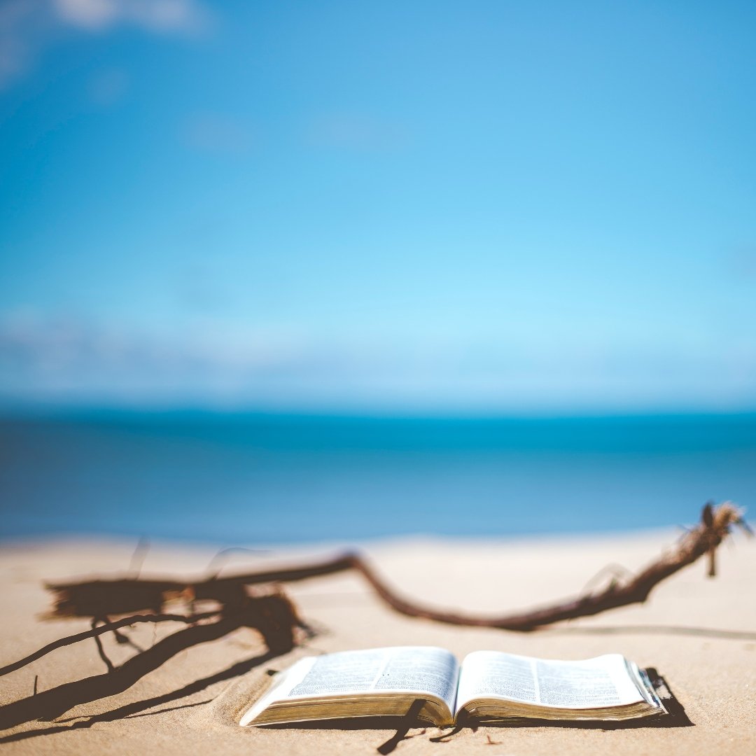 open Bible on the beach