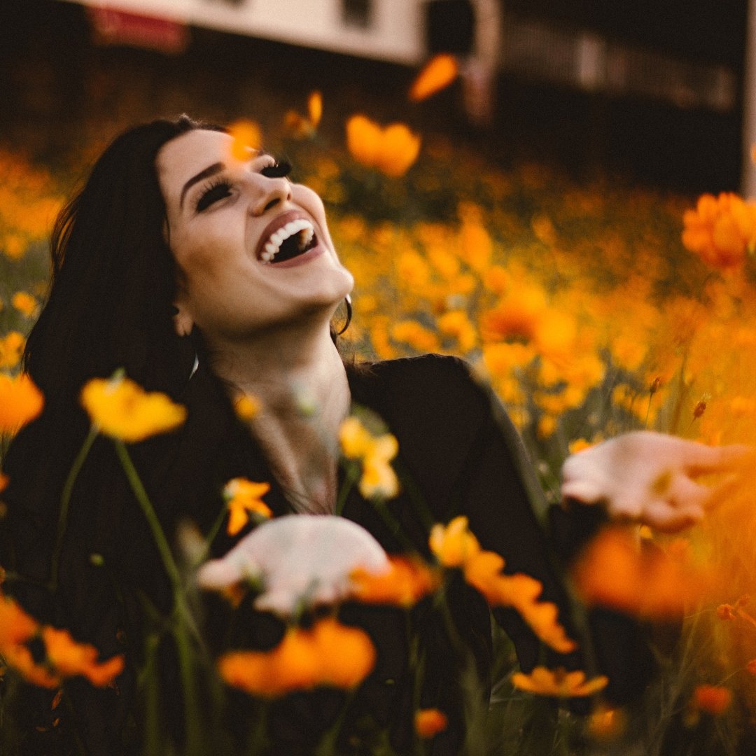 woman in field of orange flowers
