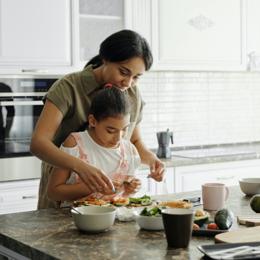 mother and daughter cooking together
