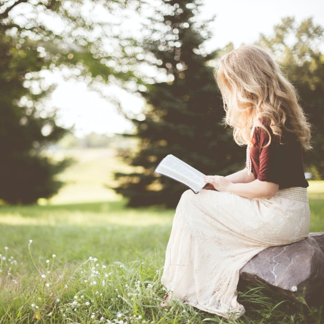 woman reading outside