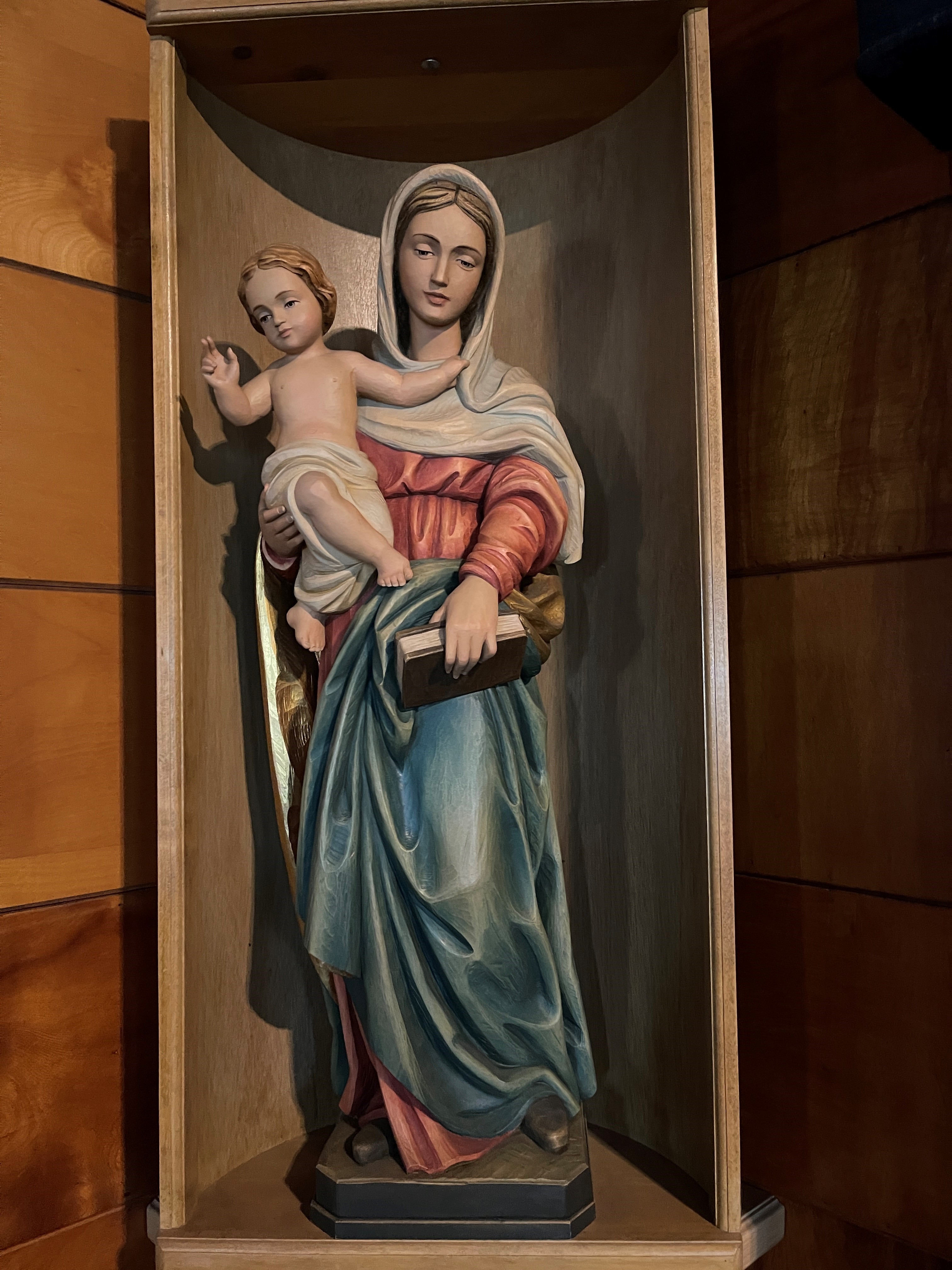 wood-carved statue of Blessed Mother and baby Jesus