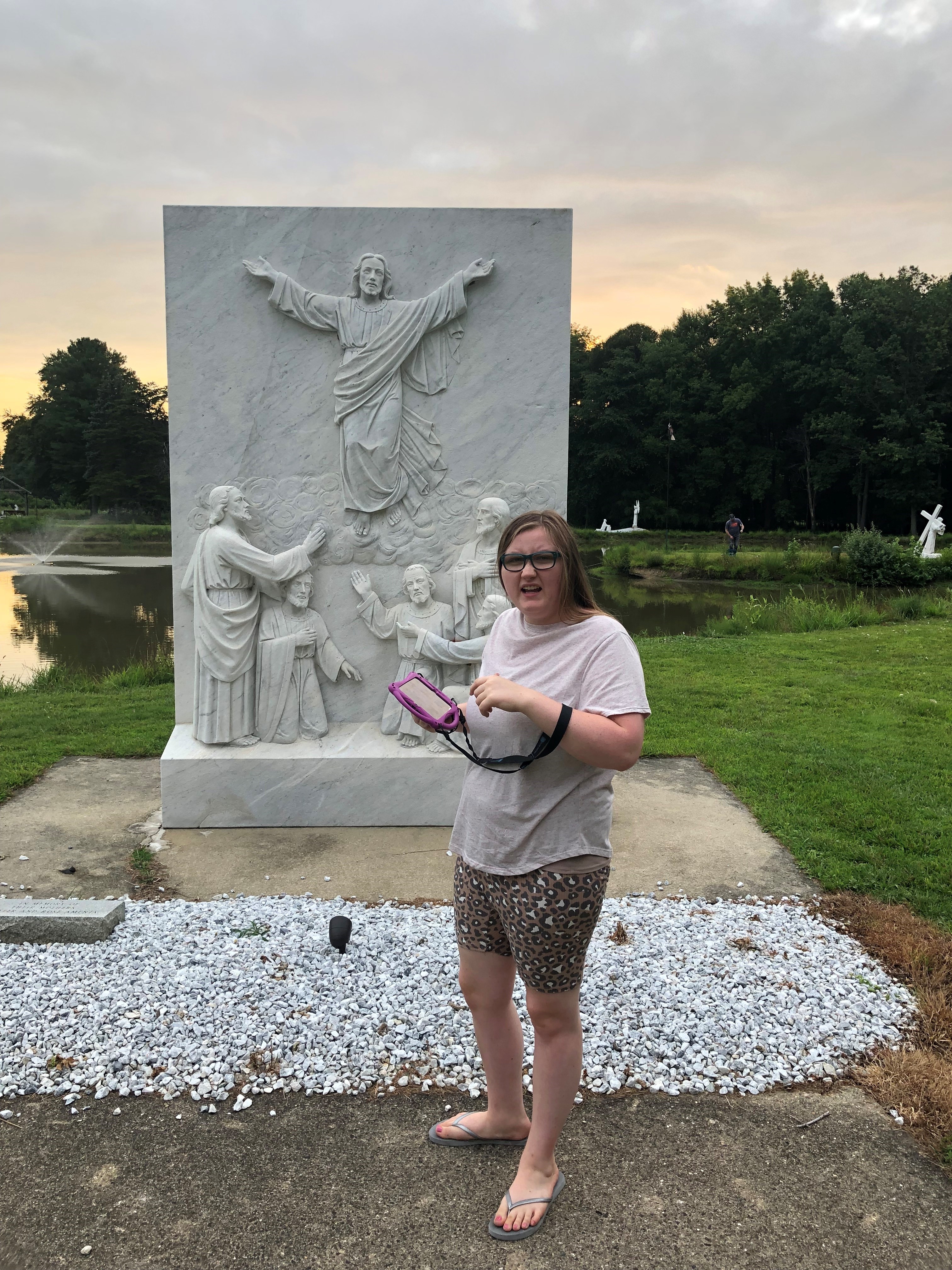 Danielle Rizzo in front of statue of the Ascension of Jesus