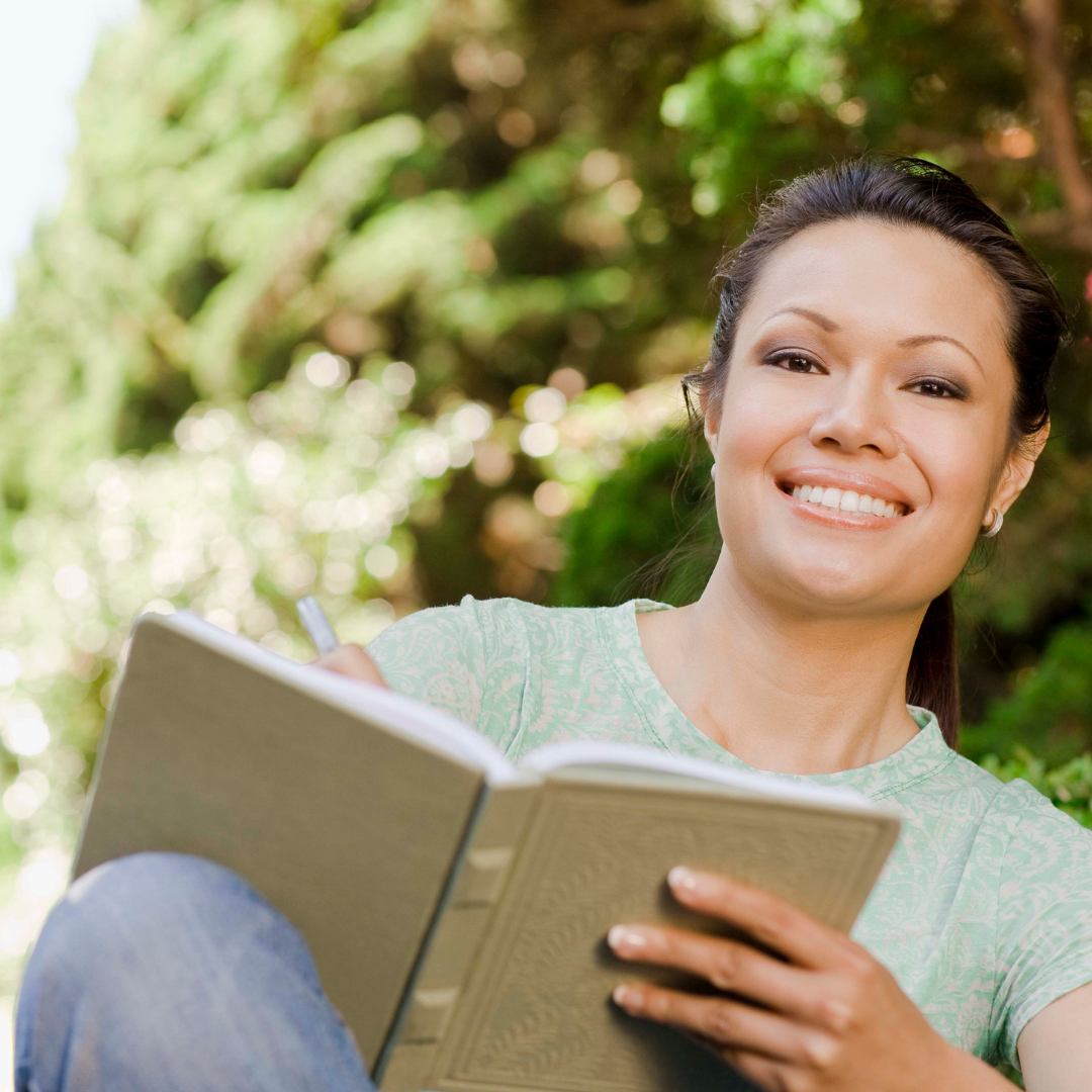 woman writing in a journal