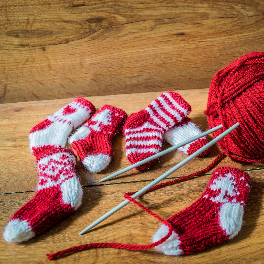 knitted socks, yarn and knitting needles