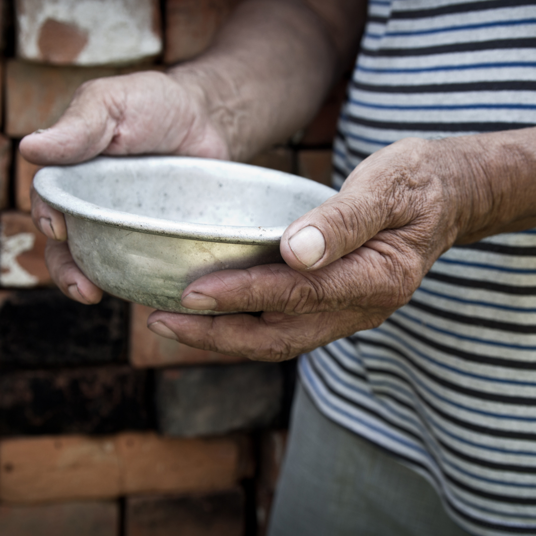 person holding out empty bowl