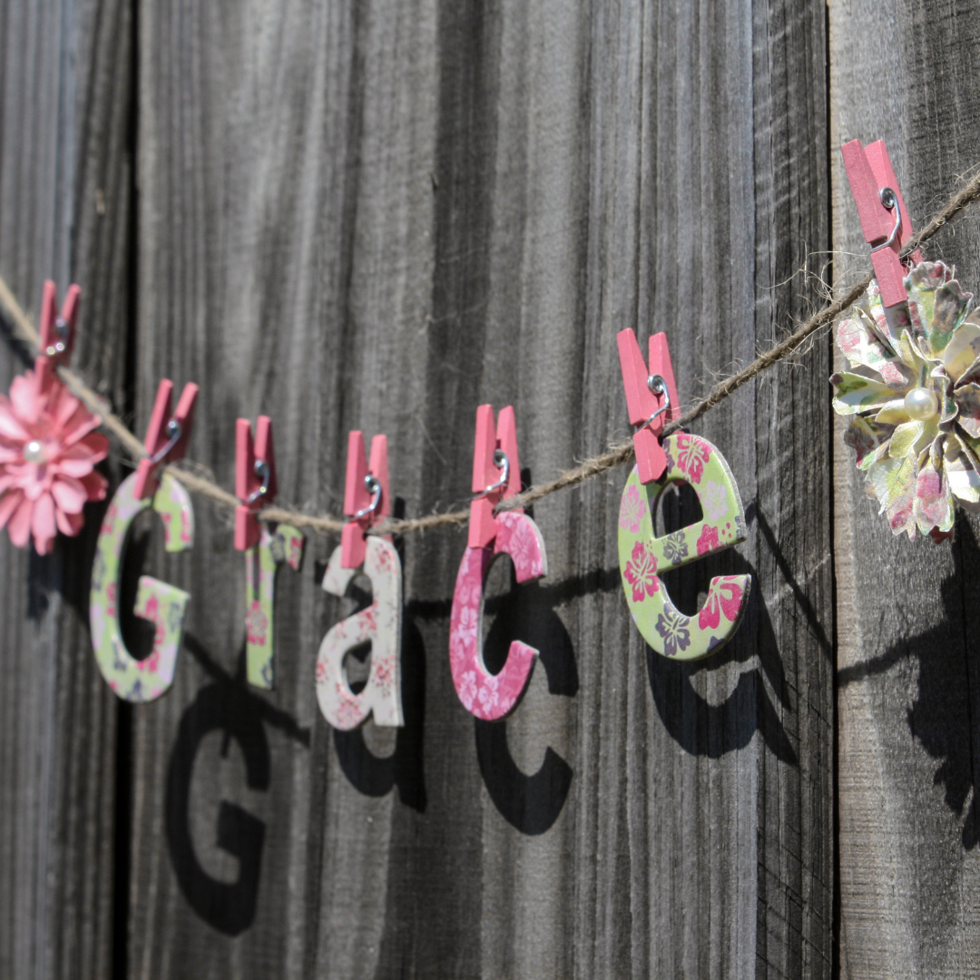 letters for "Grace" on clothesline with pink clothespins