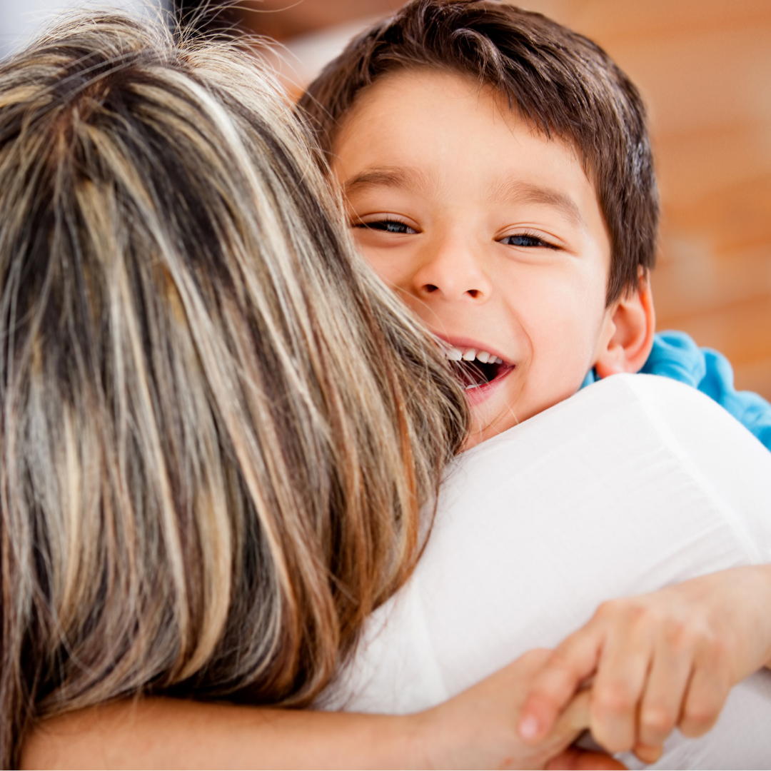 little boy hugging mom