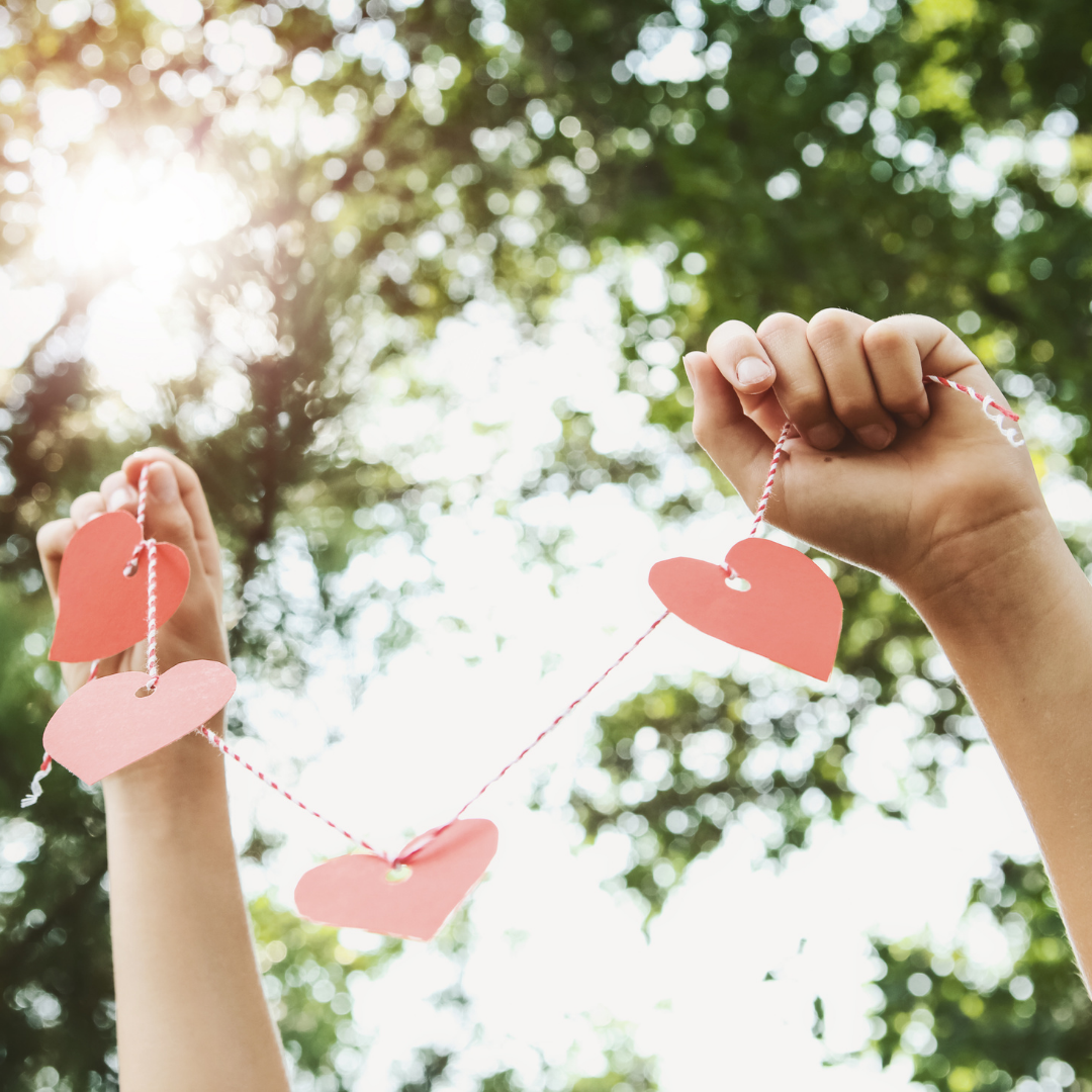 cutout paper hearts on a string