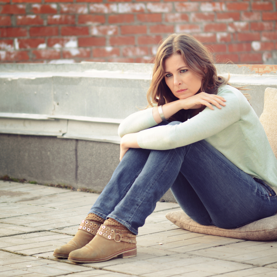 sad woman sitting on the floor