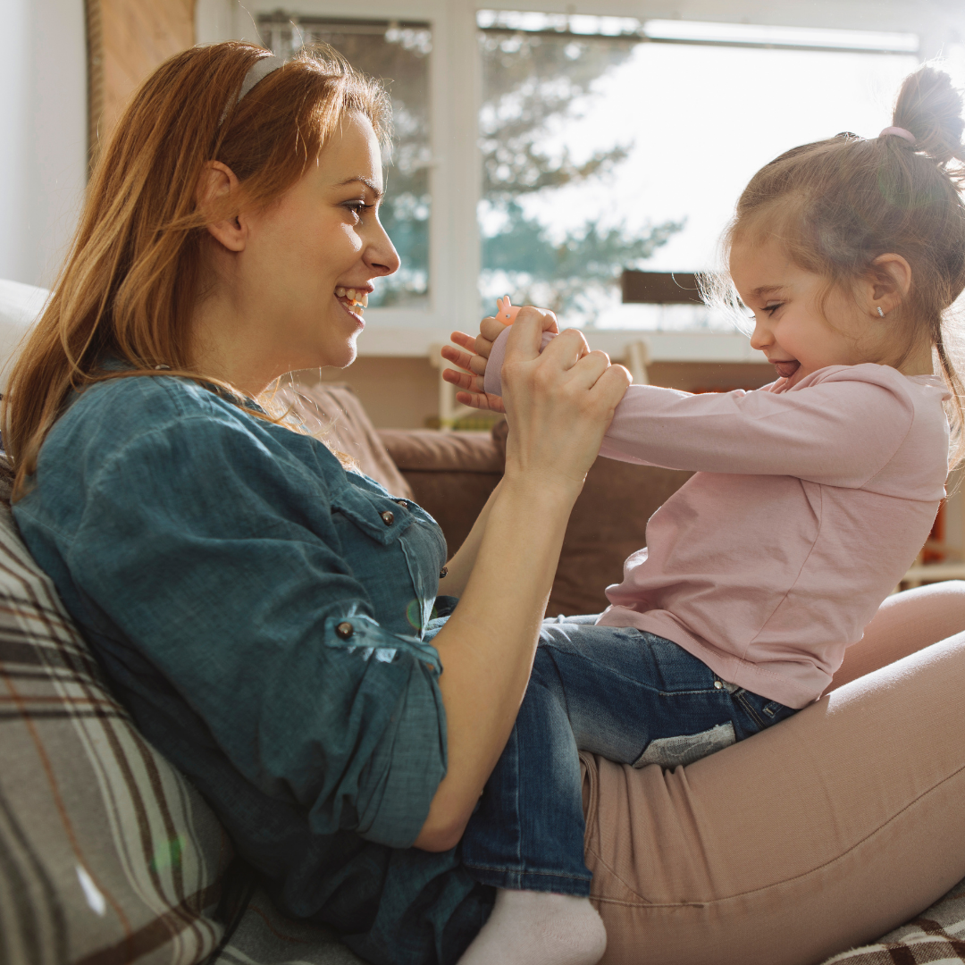 mom talking with little girl