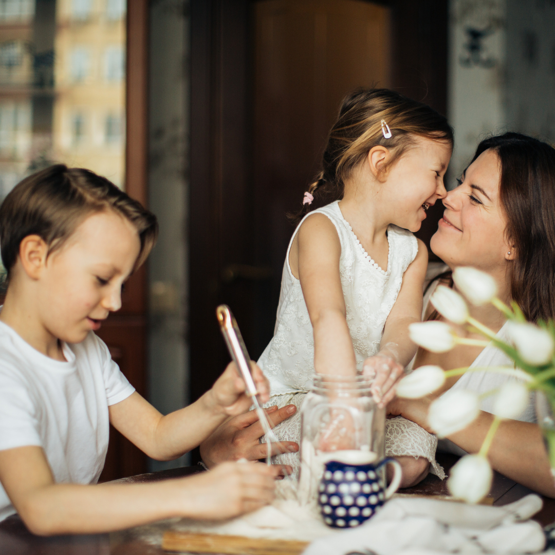 mom cooking at the table with kids