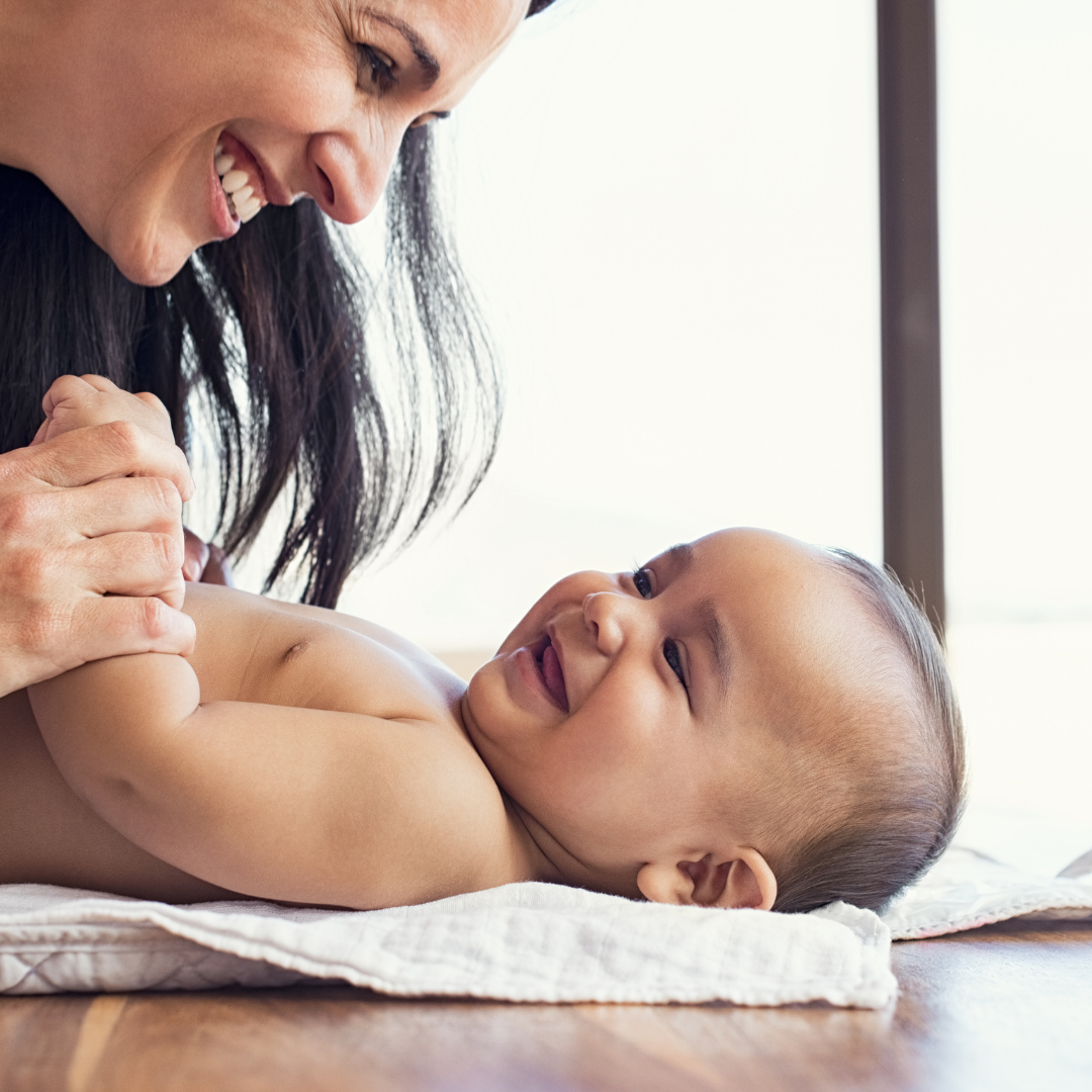 mom smiling with baby