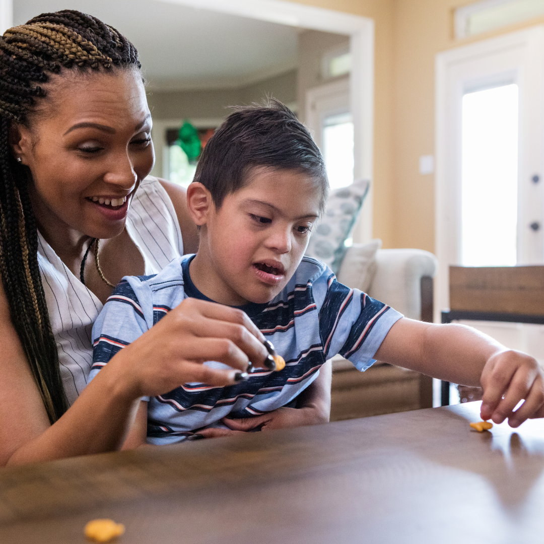 mother helping special needs child with occupational therapy