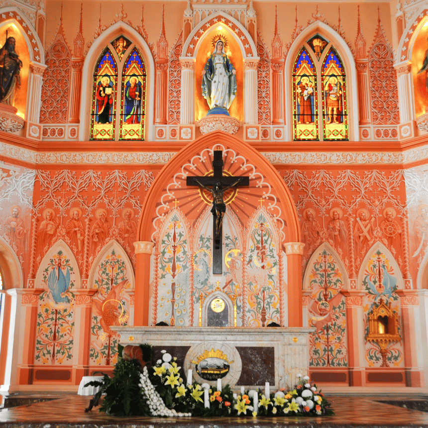interior of a church with statue of Mary above the cross