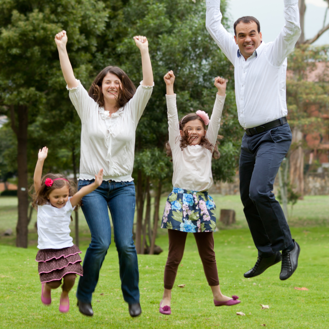 family jumping with excitement