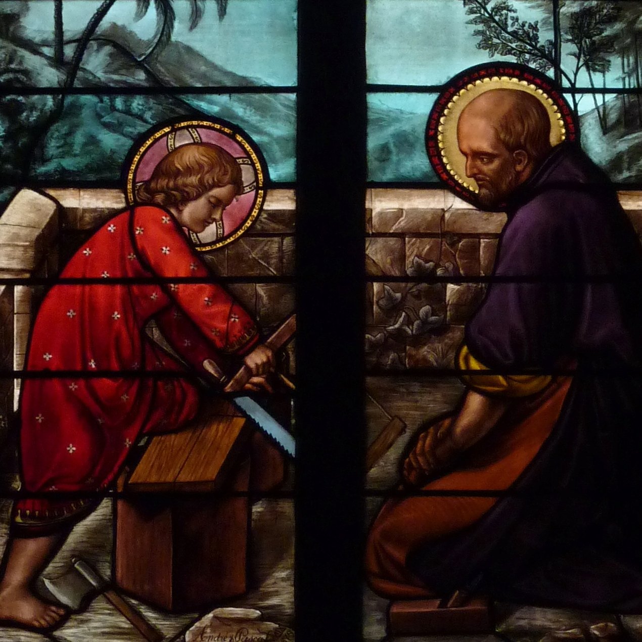 stained glass window of child Jesus and St. Joseph