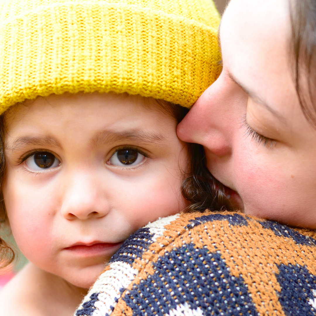 mom comforting sad child