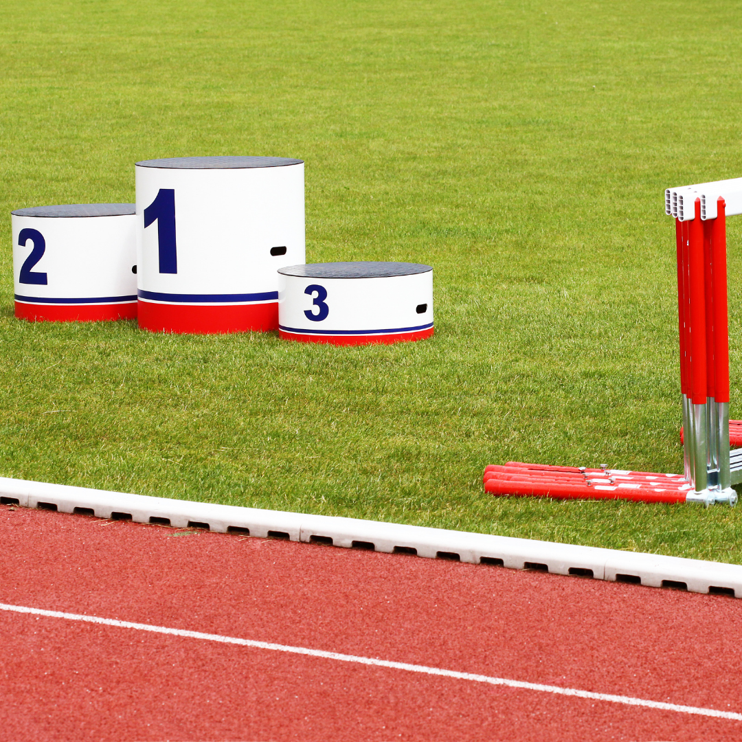 track and field podium and hurdles