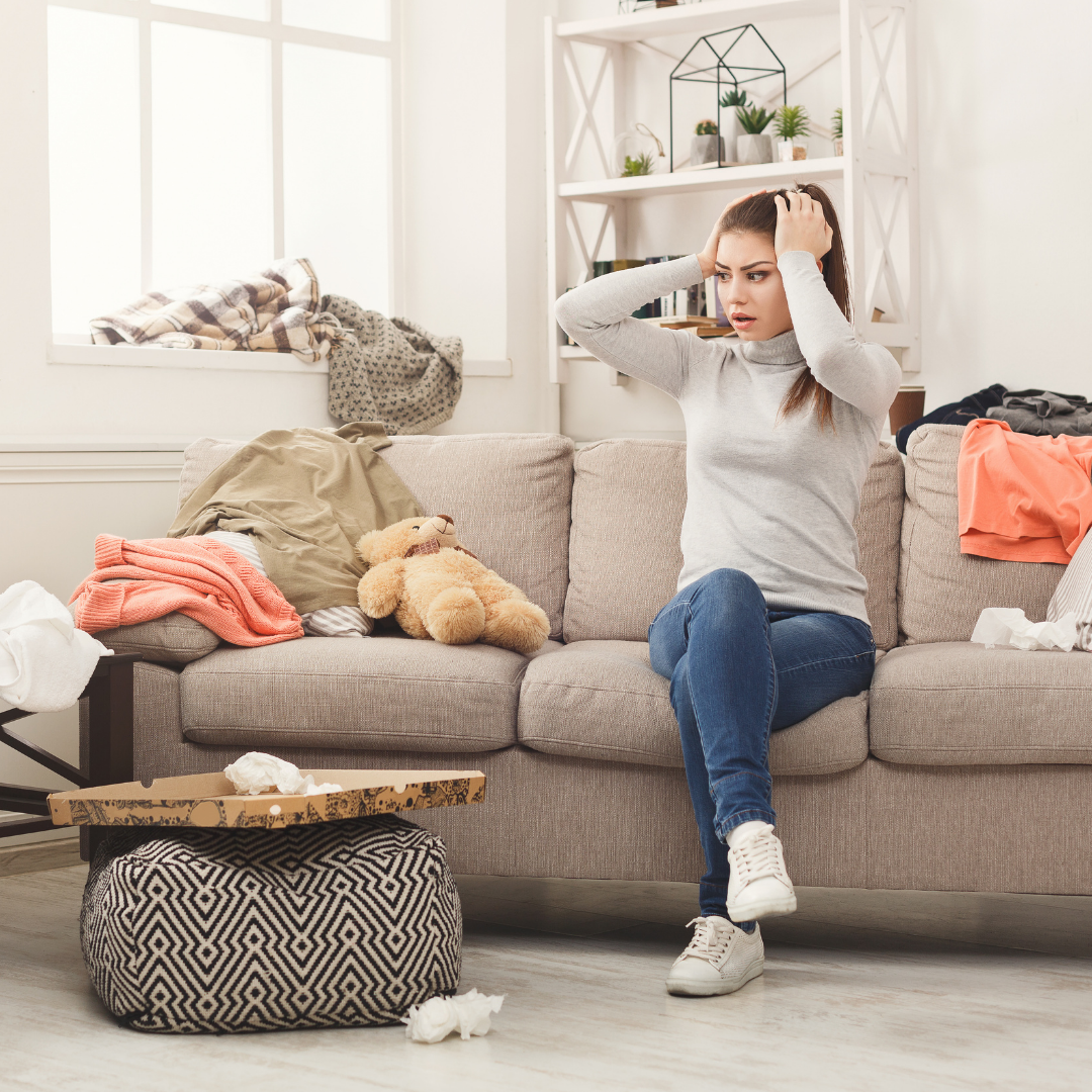 woman upset at cluttered living room