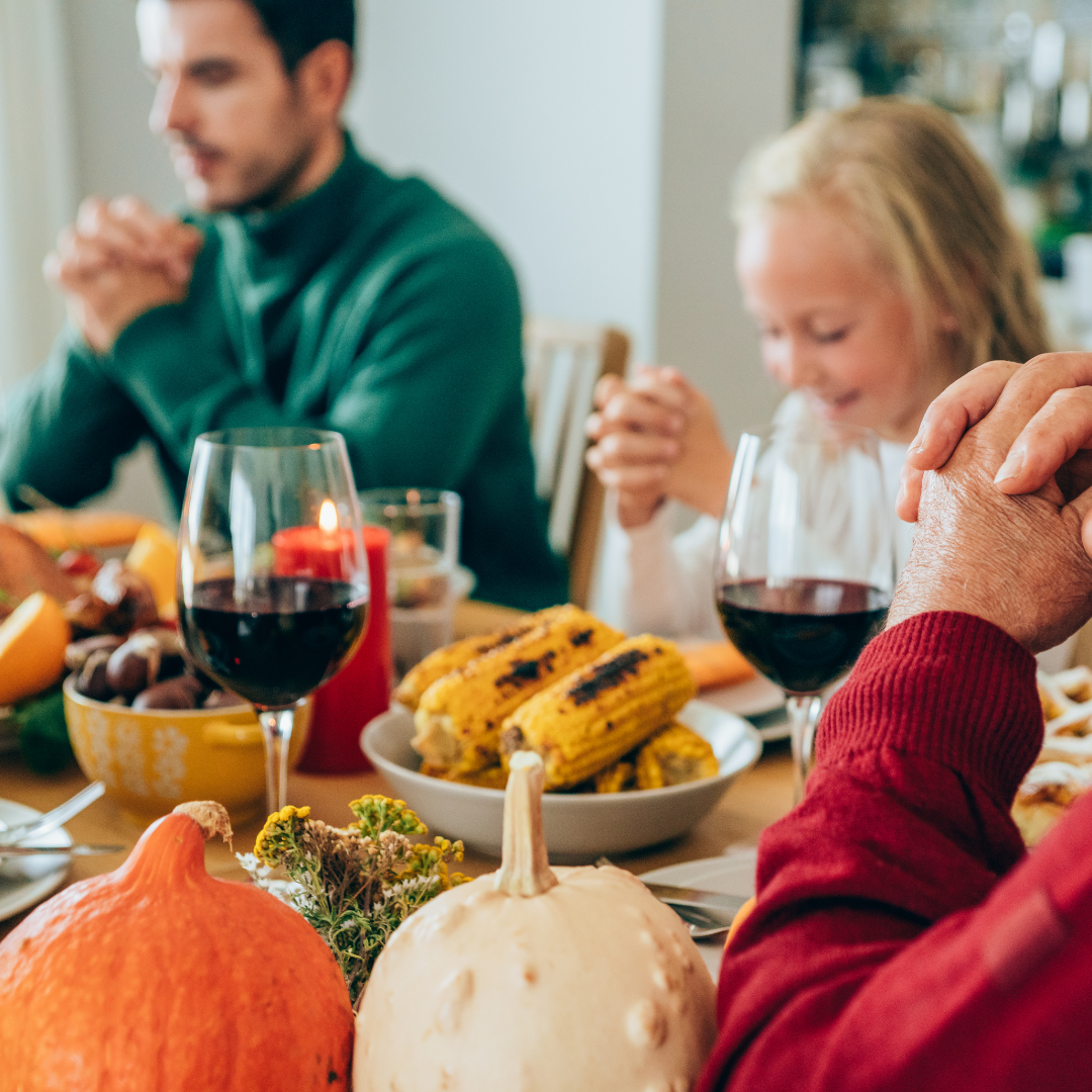 family praying at dinner