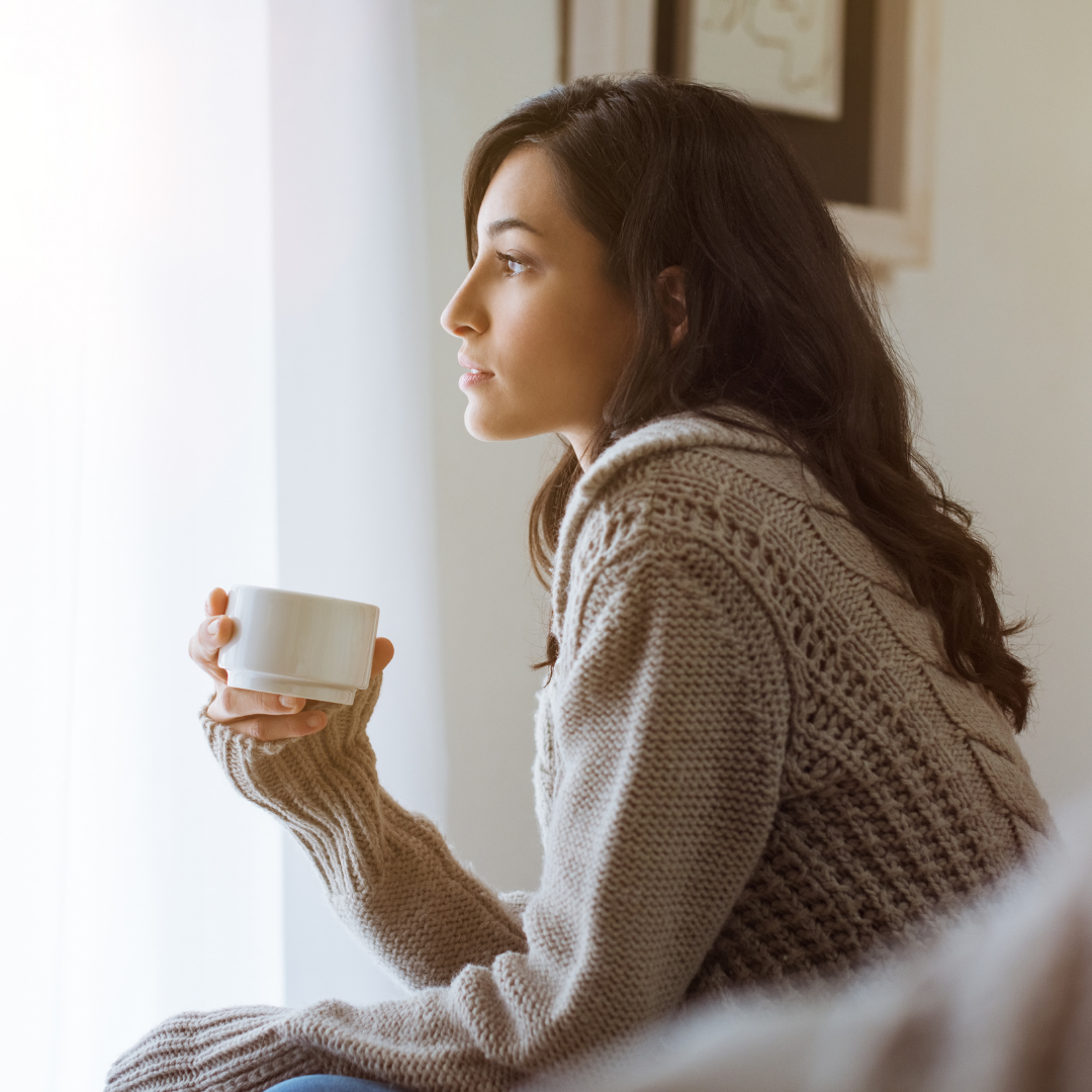 woman drinking a cup of coffee